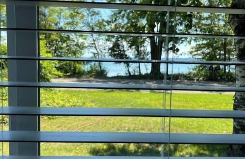 Suttons Bay House | STUNNING 100 FEET OF PRIVATE BEACH ON GRAND TRAVERSE BAY WITH HOT TUB