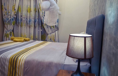 Central Kampala Bed & Breakfast | stunning golden views just a short 10-minute walk to Acacia Mall buzz