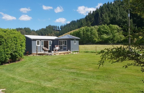 Shakespeare Bay Cottage | Stunning location garden setting, farmstead cottage!