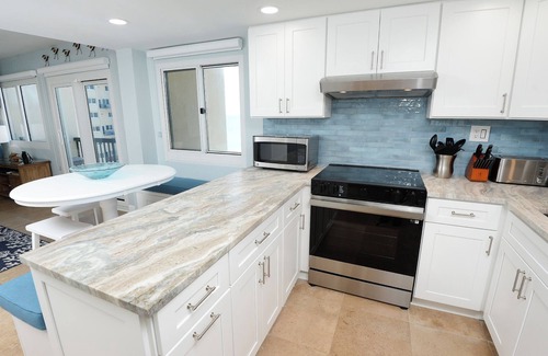 Sunnyside Condo | Stylish 2-Story Beachfront Condo with Gulf & Lake Views – Fully Renovated 2025