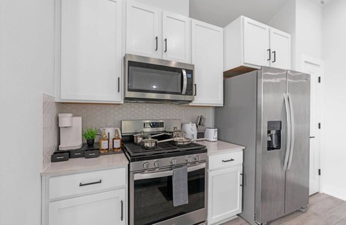 University Hills and Windsor Park House | Stylish Downtown Retreat w/Balcony, Reserved Parking + Walkable Access