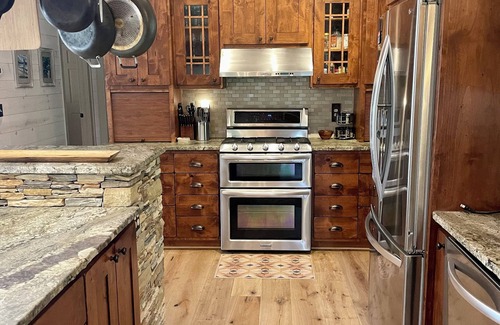 Cullowhee House | Stylish lakefront home with large flat yard, boat dock, hot tub & mountain view!