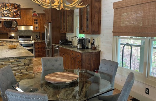 Cullowhee House | Stylish lakefront home with large flat yard, boat dock, hot tub & mountain view!