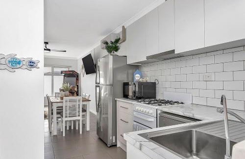 West Beach Apartment | Stylish Seaside Suite with Arcade and Balcony