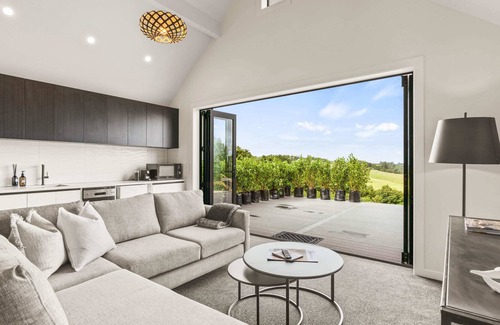 Mangawhai Villa | Stylish Space with a Green Rural outlook peaking to the Mangawhai Sand Dunes and