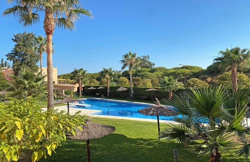 Islantilla Apartment | SUN, NATURE AND BEACH. Cozy, bright, large garden with views of pine forests