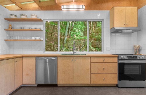 Delancey House | Sunlit Airstream in Trees with Expansive Deck + Nature Views