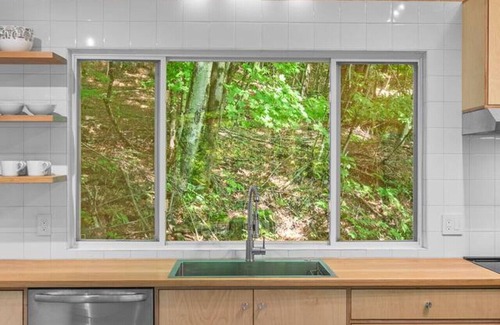 Delancey House | Sunlit Airstream in Trees with Expansive Deck + Nature Views