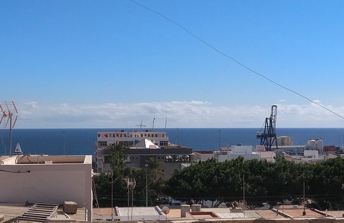 Puerto del Rosario Apartment | Sunlit apt steps from beach! Cozy and modern. Walk everywhere. Perfect getaway!