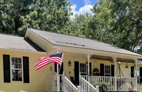 Clinton House | Sunny Happy Place wake up to birds, lush yard, and soft breeze through oak trees