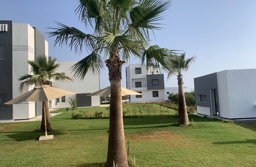 Bouficha Apartment | Superb modern app., richly furnished, pool view, lawned mountain garden