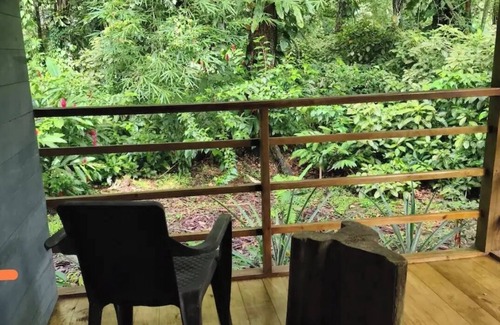 Bocas del Toro Cabin | Surfside tiny home with modern amenities like AC, modern design, bathtub,and TV.