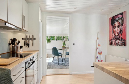 Vemmelev House | Surrounded by green meadows and fields, this inviting vacation home in Westseeland welcomes you.