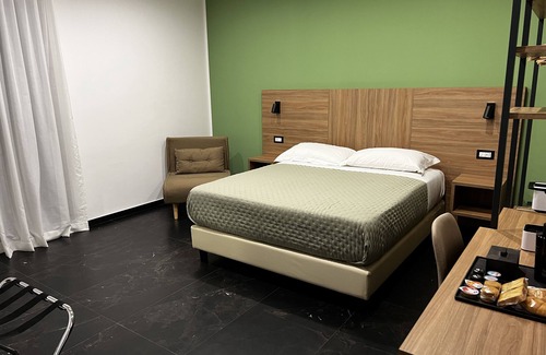 Acate Hotel | Tenuta Macconi Country Rooms, nestled in a lush citrus grove near the sea.