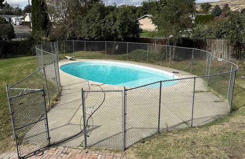 Terrace Heights House | Terrace Hights View home with a pool.
