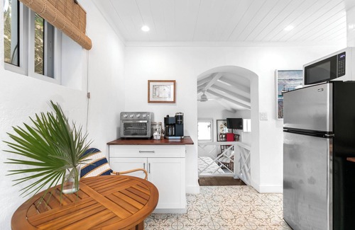Dunmore Town House | The Blue Bungalow: A charming cottage set above the water in Harbour Island