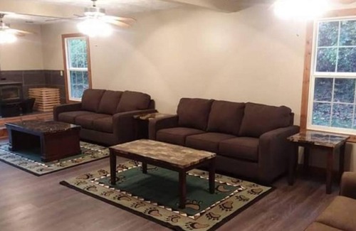 Fort Gay Cabin | The Bunkhouse A two story rustic cabin 3BR 2BA