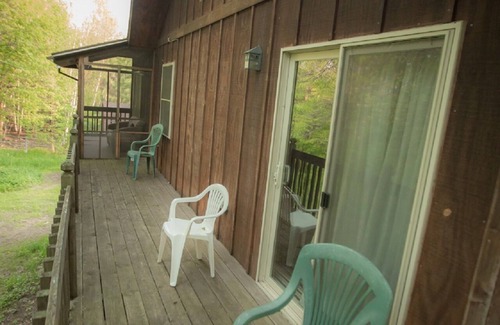 Finlayson House | The Cedar House Is Uniquely Set In The Forest Surrounded By Decks And Porches.
