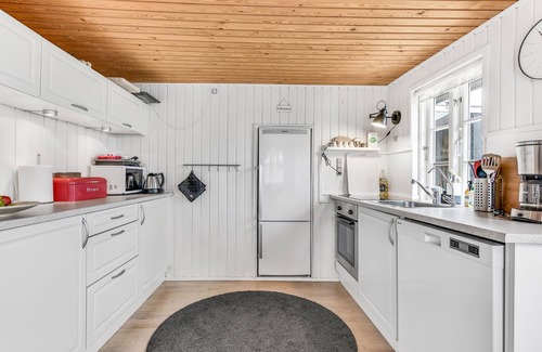 Broager House | The charming cottage offers you a fantastic view of the water.