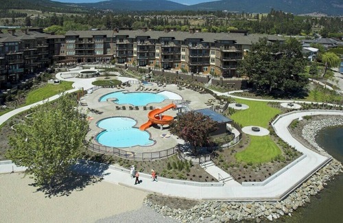 Westbank Condo | The Cove Lakeside, private grnd flr w/large covered deck, lake, park, mtn view