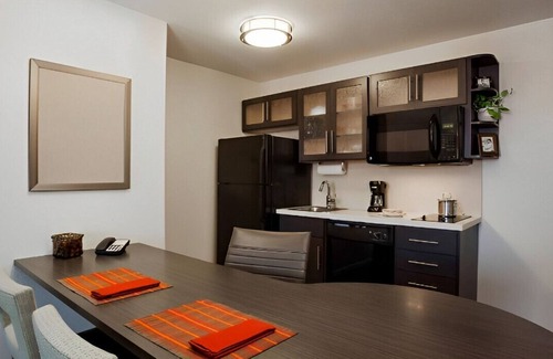 Plano House | The Finest in Suite Living with a Full Kitchen!