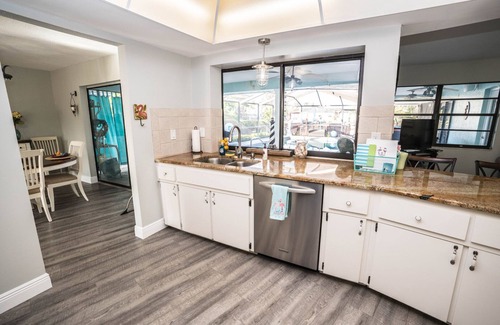 Apollo Beach House | The Flamingo- Waterfront Home with heated pool, hot tub and kayaks!