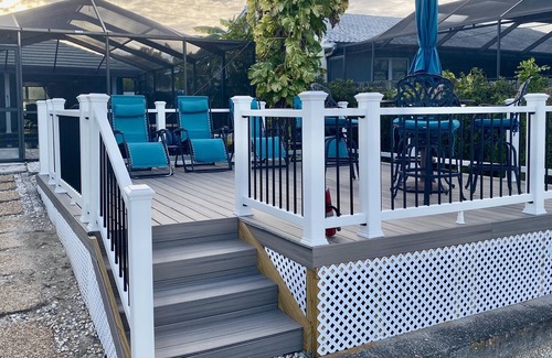 Apollo Beach House | The Flamingo- Waterfront Home with heated pool, hot tub and kayaks!