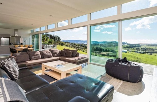 Mangawhai House | The Glass House - Modern, pet-friendly designer holiday home with spectacular views and spa pool