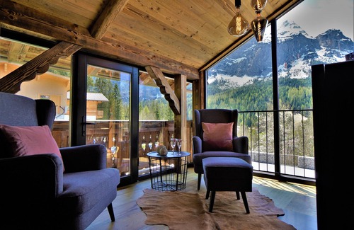 Ehrwald Ski Chalet | The Hof Chalet on the Zugspitze with mountain views, private garden, hot tub, sauna.