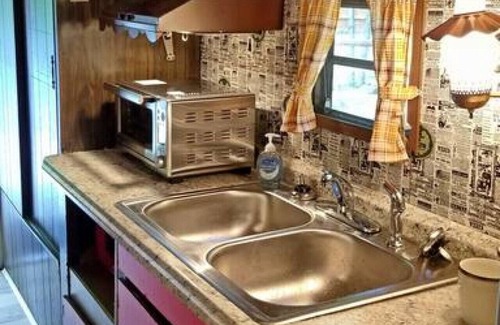 Bryson City RV Rental | The Lil' Red Caboose on the creek!