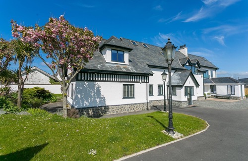Trearddur Bay Cottage | The Old Abbey - a hot tub that sleeps 16 guests in 6 bedrooms