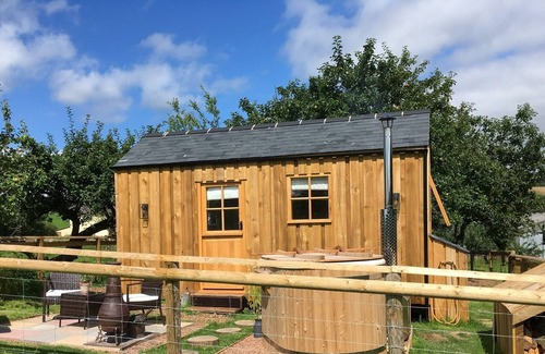 Brushford House | The Orchard Hut- A bespoke shepherds hut with wood fired hot tub.