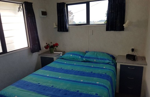 Parawera House | The Organic Farm Hut is located in a working farm. experience the country life!