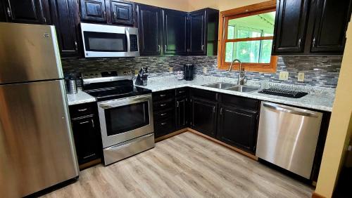 Pocono Mountain Lake House | The Pocono's Retreat with a Gameroom, Firepit, and Lake