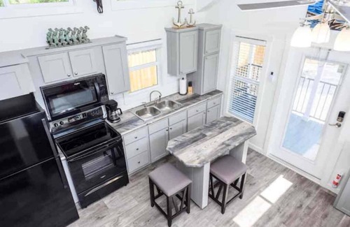 Rockport Cottage | The Rattle Trap Tiny house fenced yard