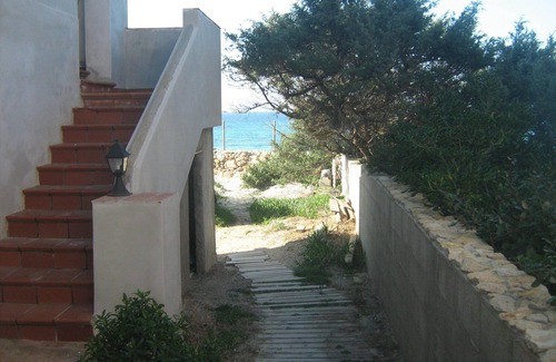 Sa Rocca Tunda Villa | The Sound of the Sea. House on the beach, surrounded by greenery, Sardinia.