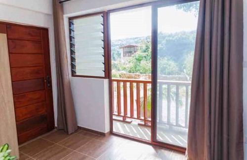 Aburi Apartment | The Treehouse Studio apartments with a large rooftop terrace.