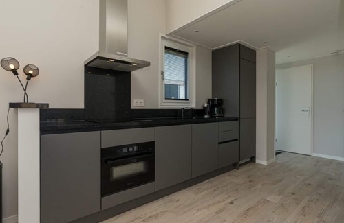 Burgh-Haamstede House | This 4-person chalet is ready to welcome you on the edge of the park. The chalet has a modern living