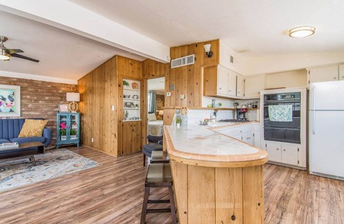 The Garden District House | This centrally located 1 bedroom features a full size pool and electric vehicle charging on site.