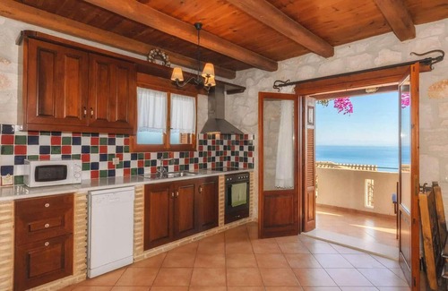 Xirokastello House | This charming stone villa sits in a prime coastal location, set down off the main coastal road leadi