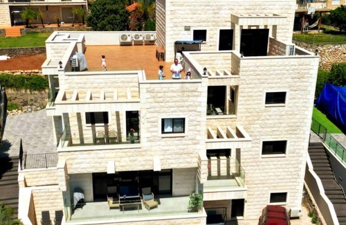 Tiberias Apartment | This cozy apartment offers ample space, featuring a comfortable living room perfect for relaxation