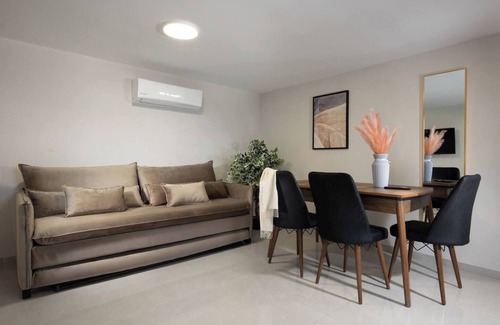 Tiberias Apartment | This cozy apartment offers ample space, featuring a comfortable living room perfect for relaxation