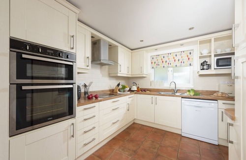 Truro House | This holiday home is situated right on the water’s edge within the Malpas Marina