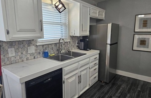 Odessa House | This modern 4-Bedroom features a spacious interior and exquisite backyard.