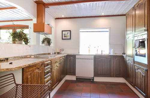 Varde House | This vacation home is located directly in the forest, yet close to the town of Varde.