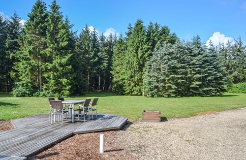 Varde House | This vacation home is located directly in the forest, yet close to the town of Varde.