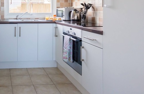 Bacton Ski Chalet | Tides, seaside home, dog friendly, peaceful park in Bacton, by the sea, wi-fi