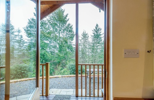 Westleigh Ski Chalet | Timber lodge set in an elevated woodland position with views of the lake.