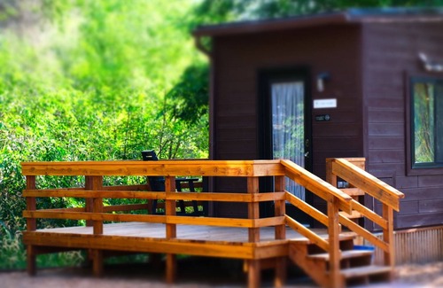 Montrose House | Tiny home located beside a creek.