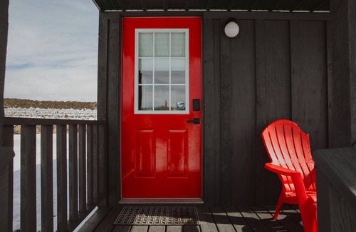 Meeker House | Tiny Home with one Queen bed and a Futon couch. Sleeps: 3
